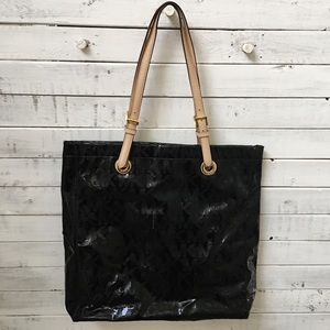 Michael kors black leather monogrammed tote bag.